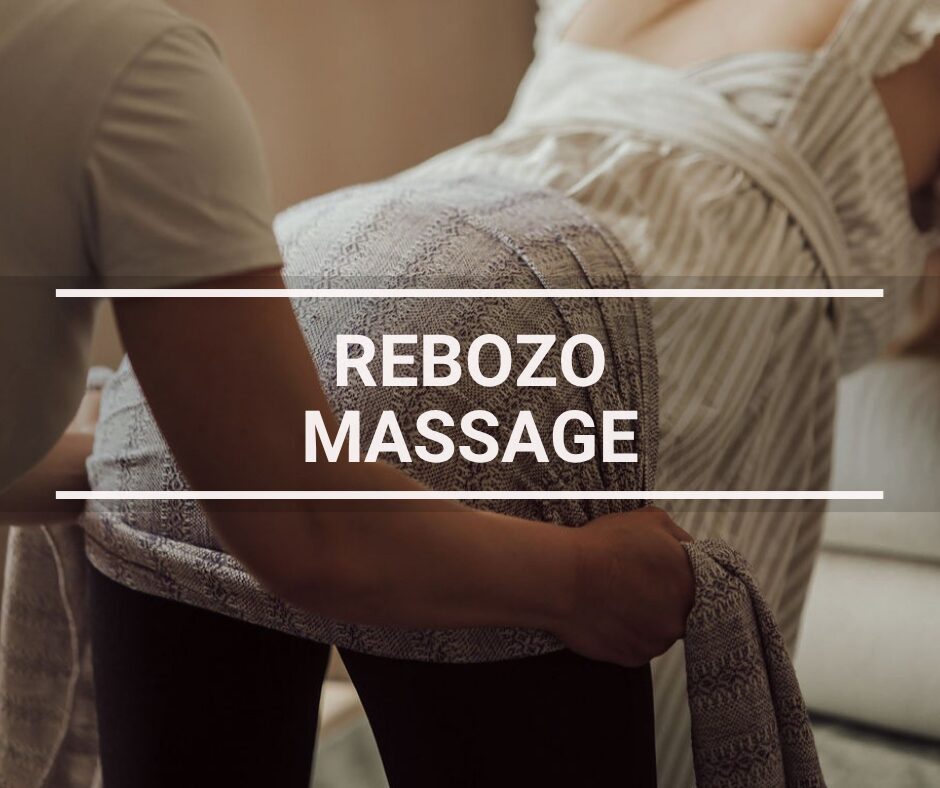 A woman getting a rebozo massage